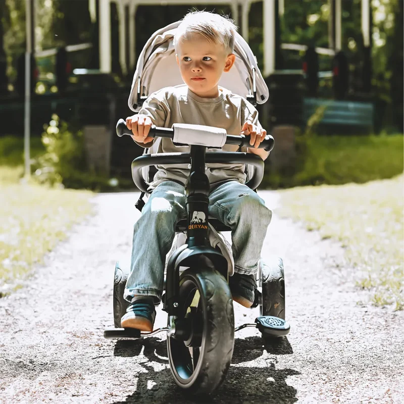 Triciclo Explorer Luxe con maniglione - Pieghevole con cestino color crema