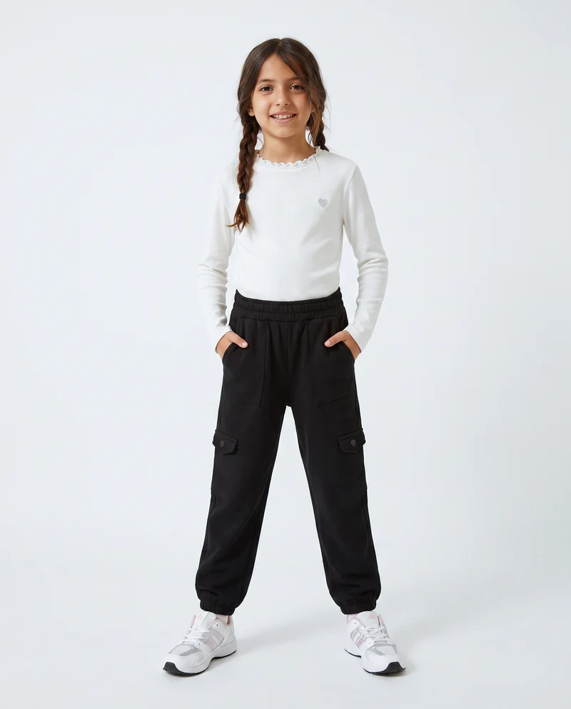 Jogger bambina comodi con tasconi e vita elastica - Nero