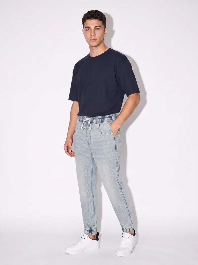Jeans jogger con vita elasticizzata - Denim chiaro