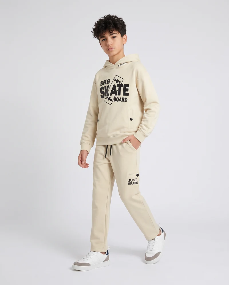 Jogger in felpa con tasche laterali - Beige