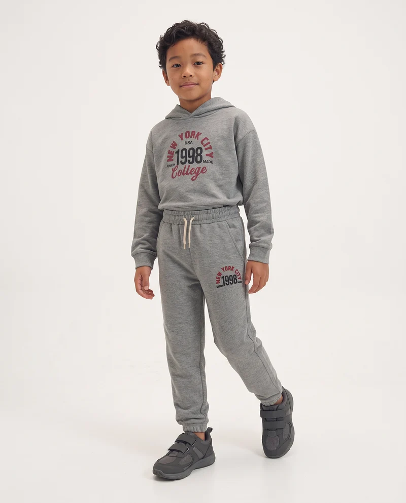 Jogger in felpa con stampa college - Grigio chiaro mel.