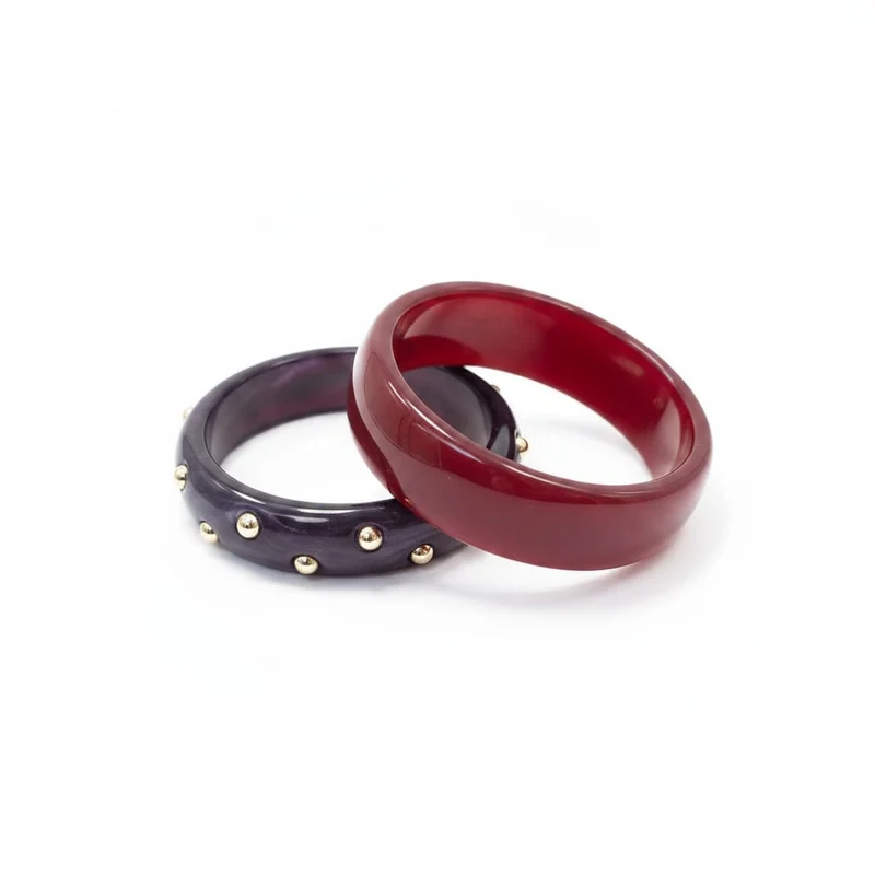 Bracciali rigidi in plastica con borchie - Rosso