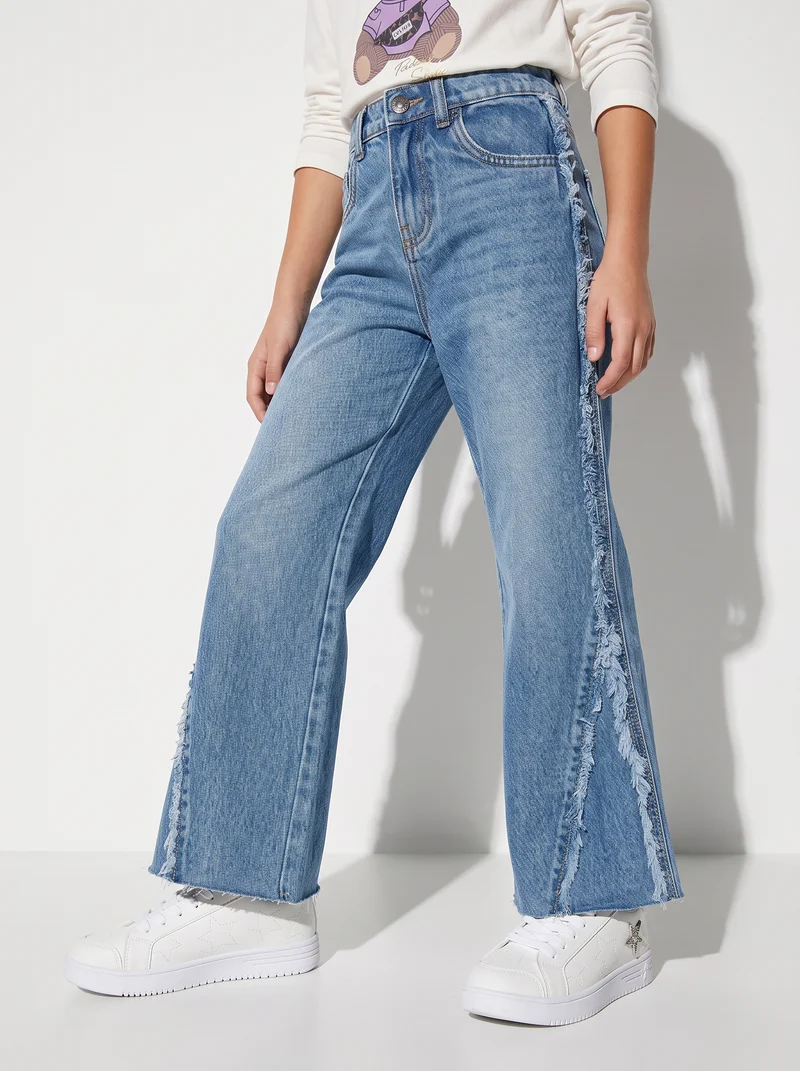 Jeans flare fit con frange laterali - Denim