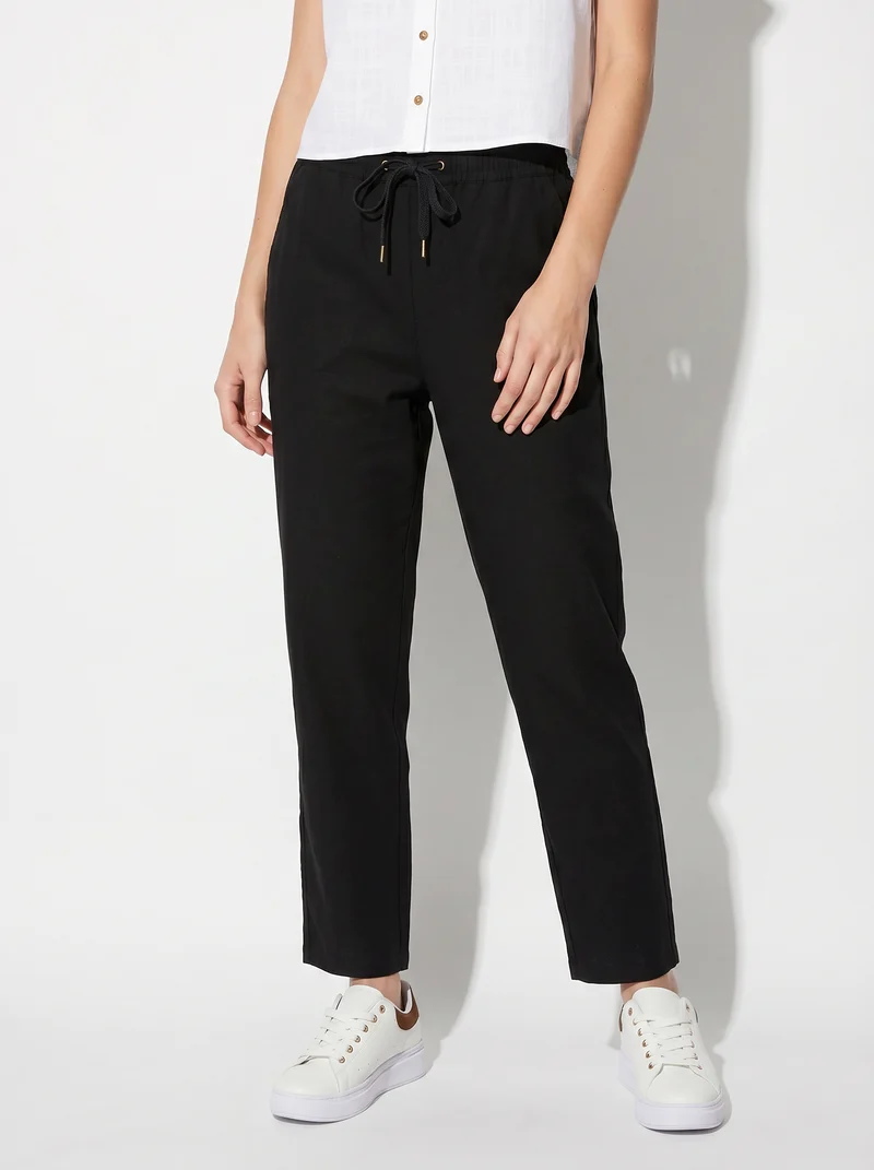 Pantalone con elastico e coulisse in vita - Nero