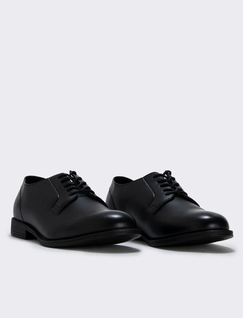 Scarpa stringata uomo in poliuretano nero - Nero