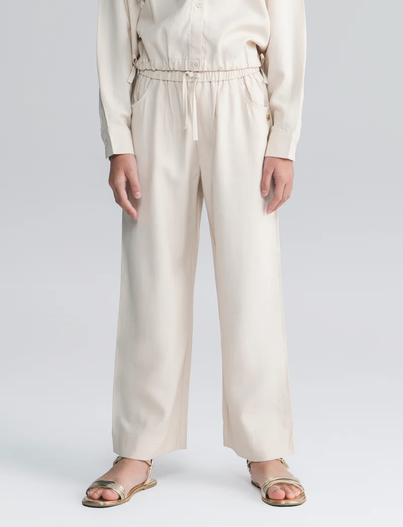 Pantalone da bambina gamba ampia ed elastico - Beige