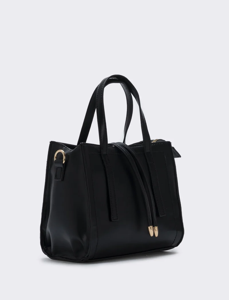 Borsa semirigida a mano con laccetti - Nero
