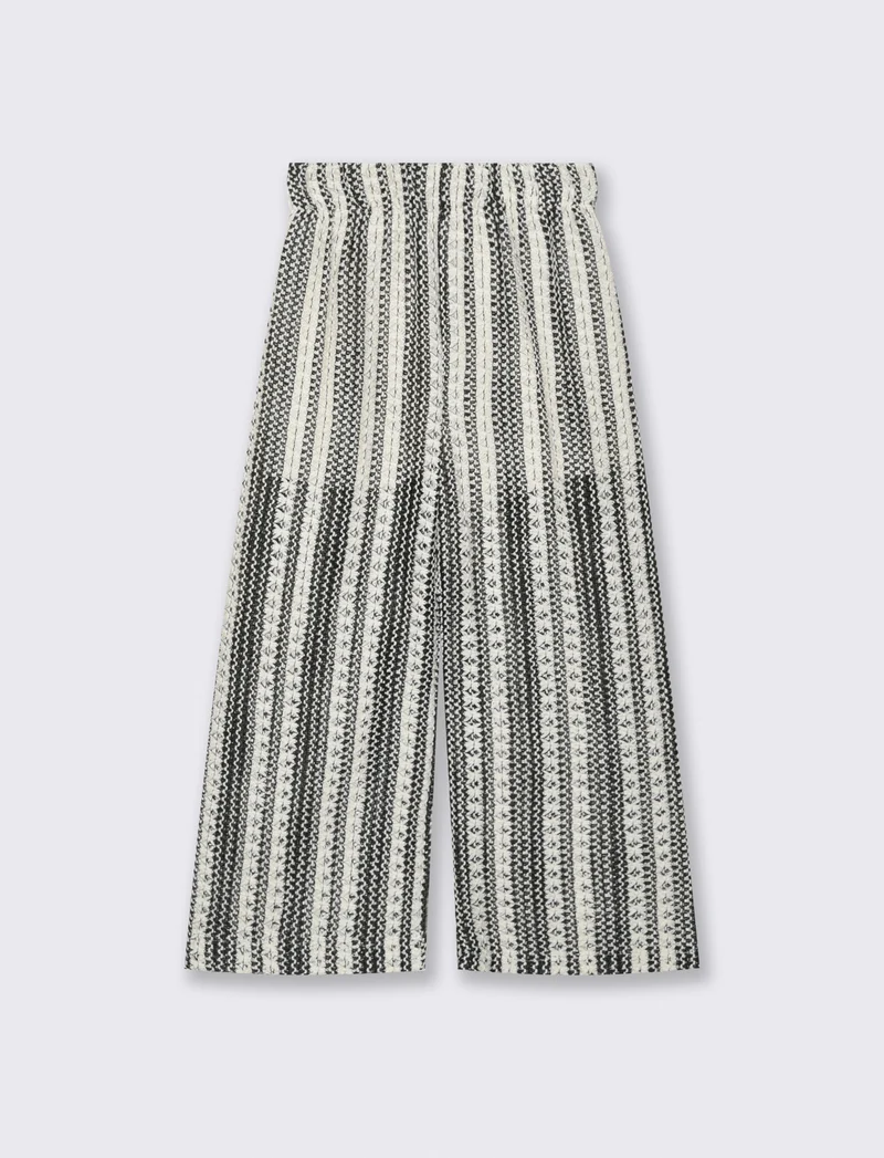 Pantaloni in tessuto a rete traforato. - Fantasia