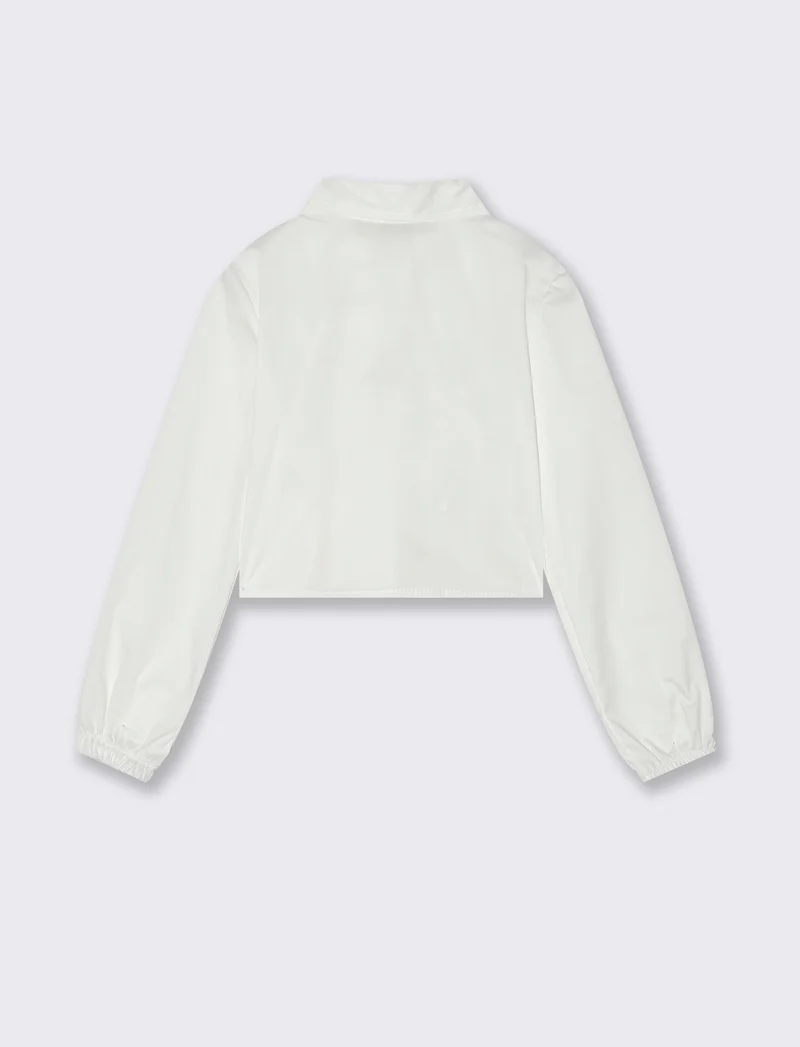 Camicia manica lunga cropped da bambina con stampa brillante. - Bianco