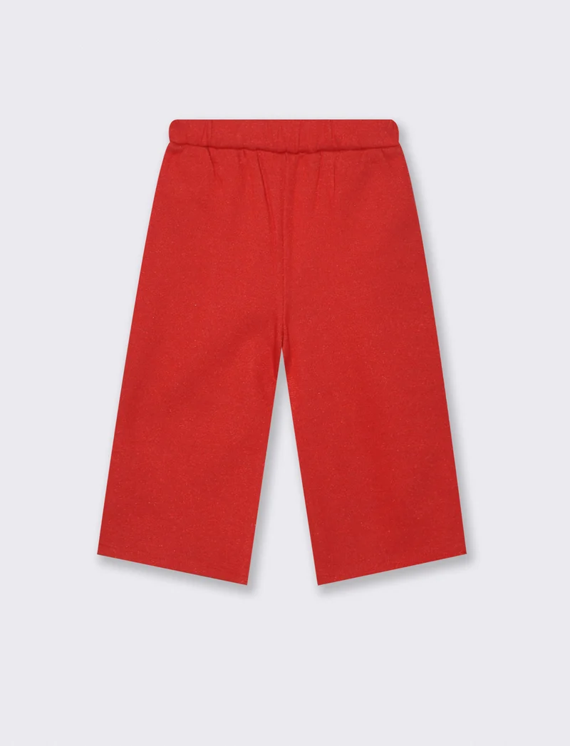 Pantaloni dal tessuto brillante. - Rosso