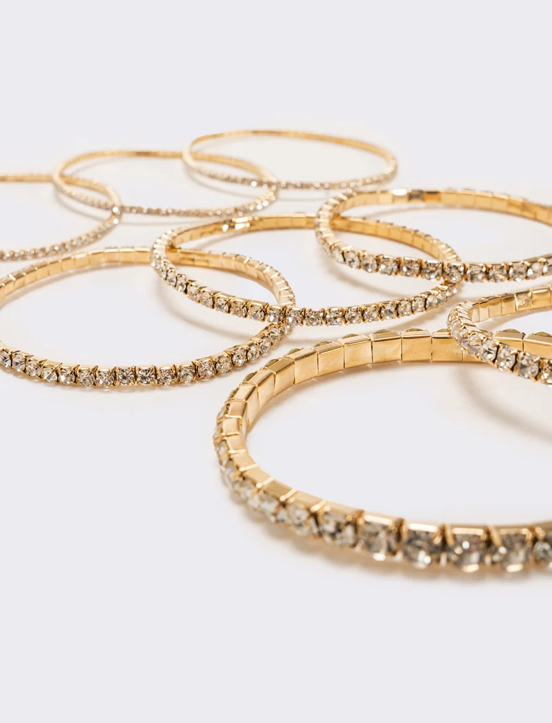 8 bracciali elastici con strass - Oro