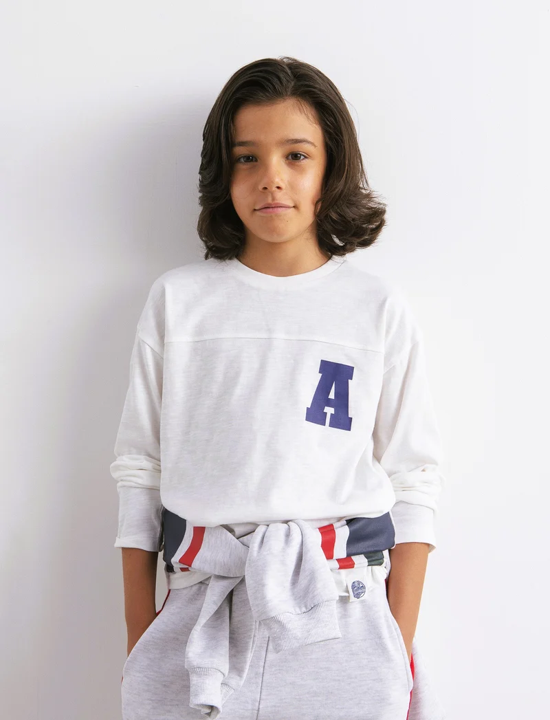 T-shirt manica lunga con taglio frontale. - Bianco latte