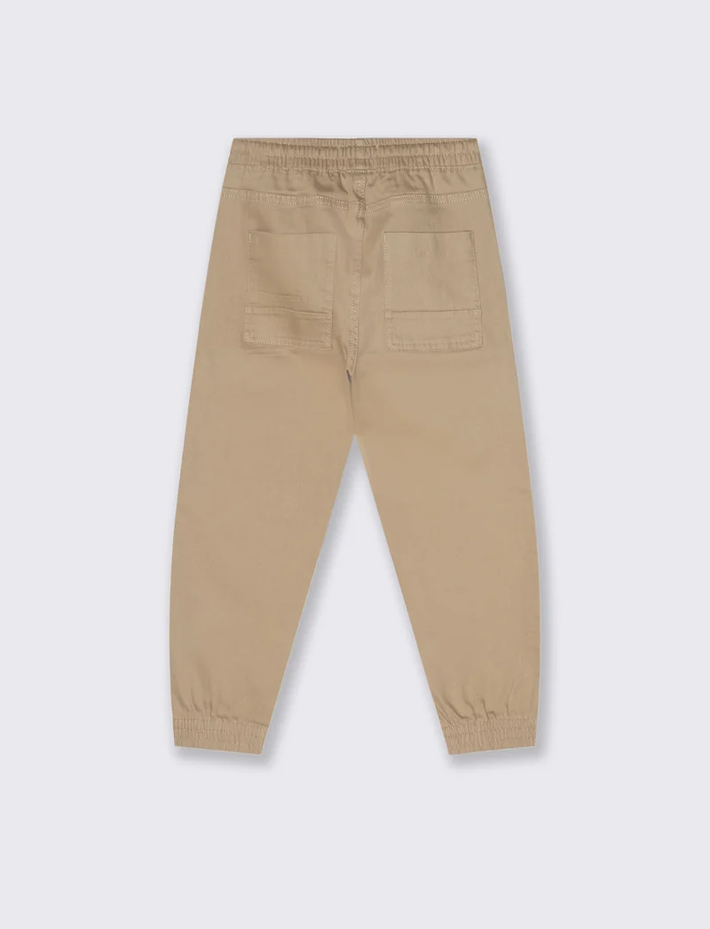 Jogging con tasconi. - Beige
