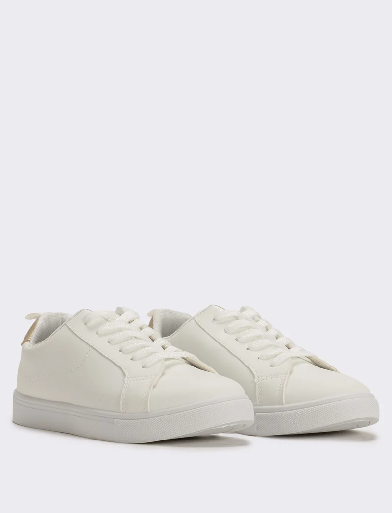 Sneakers bianche monocolore con platino - Bianco