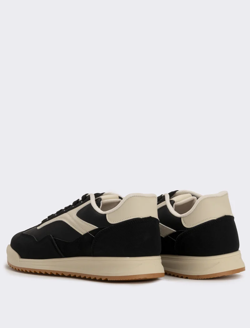 Sneakers nere in poliuretano con dettagli bianchi - Nero