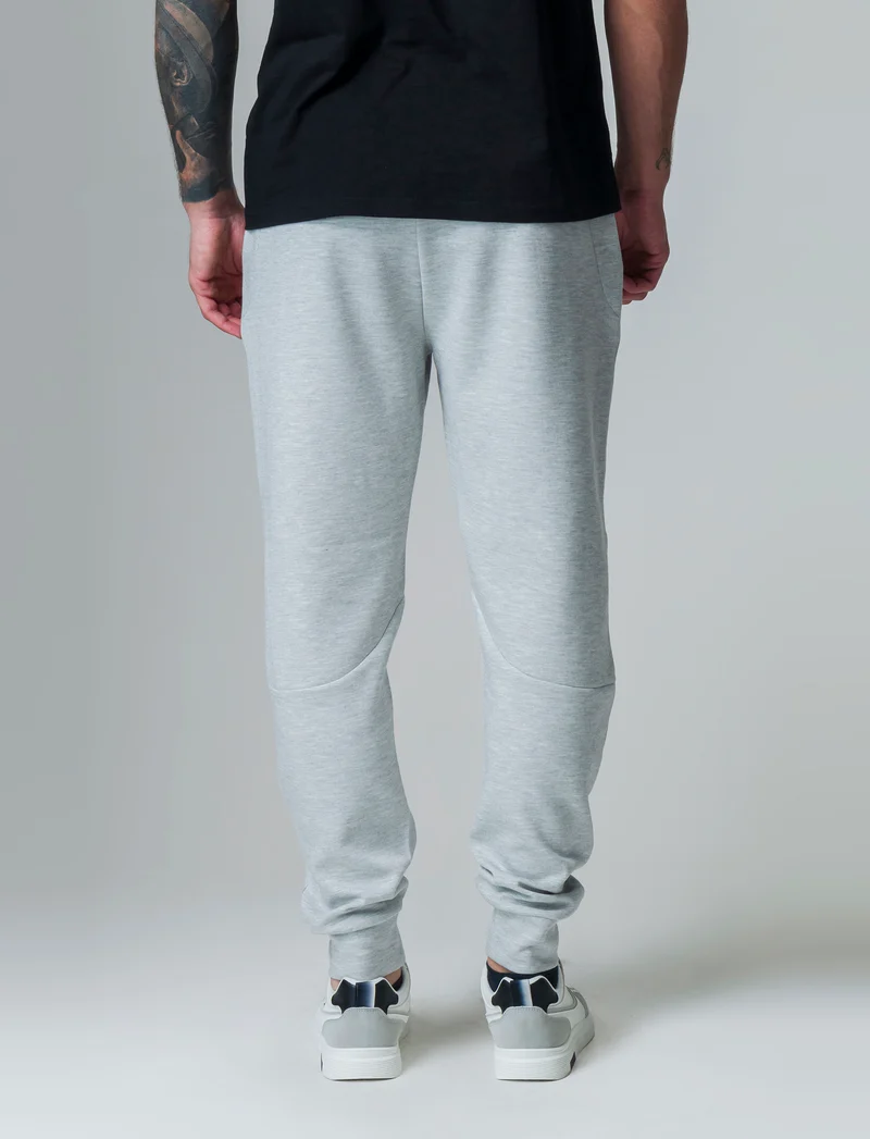 Pantaloni sportivi in interlock: da uomo - Grigio mel.
