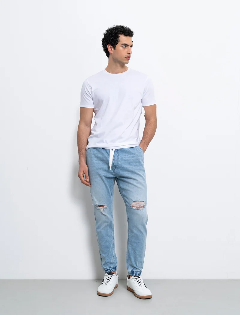 Jeans denim medio con vita jogger e strappi da uomo - Denim