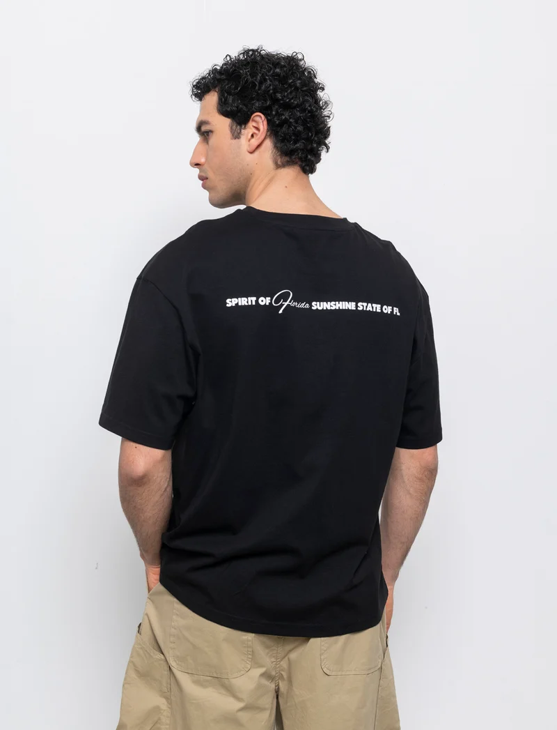 T-shirt boxy fit con stampa da uomo - Nero
