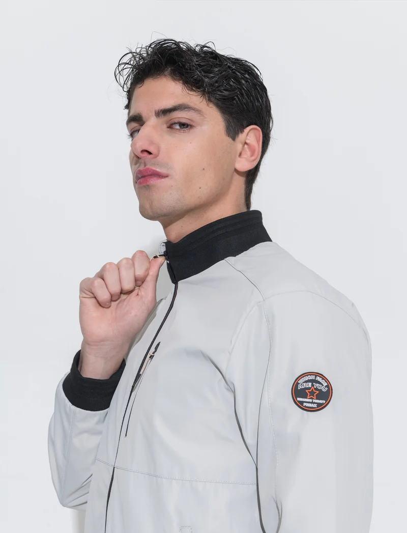 Giubbotto antivento sportivo da uomo - Grigio ghiaccio